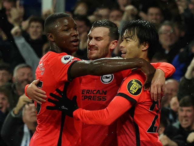 Brighton & Hove Albion's Kaoru Mitoma celebrates scoring their first goal with Pascal Gross and Moises Caicedo on January 3, 2023