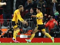 Wolverhampton Wanderers' Hwang Hee-chan celebrates with Matheus Cunha after scoring against Liverpool on January 7, 2023