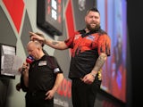 Michael Smith responds after hitting a nine-darter in the World Championship final against Michael van Gerwen on January 3, 2023