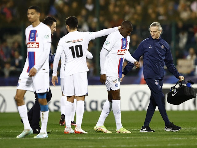 Paris Saint-Germain's (PSG) Nordi Mukiele leaves the field after receiving medical attention on January 6, 2023