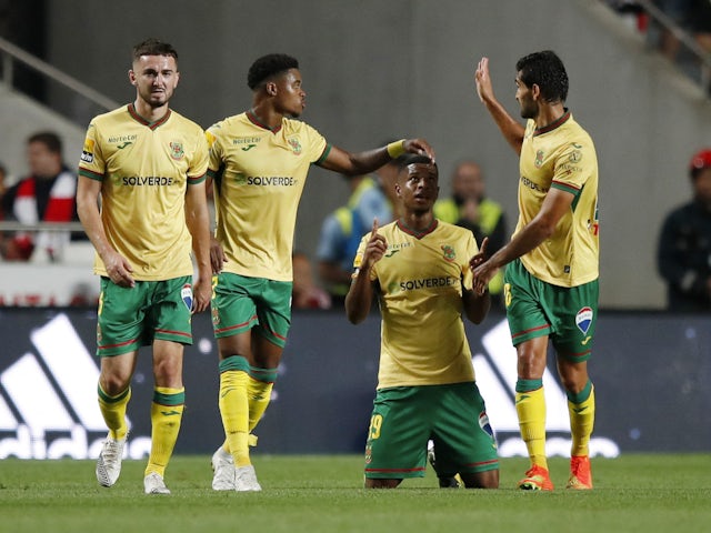 Pacos de Ferreira's N'Dri Philippe Koffi celebrates scoring their first goal with teammates on August 30, 2022