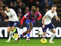 Crystal Palace's Wilfried Zaha in action with Tottenham Hotspur's Bryan Gil and Oliver Skipp on January 4, 2023