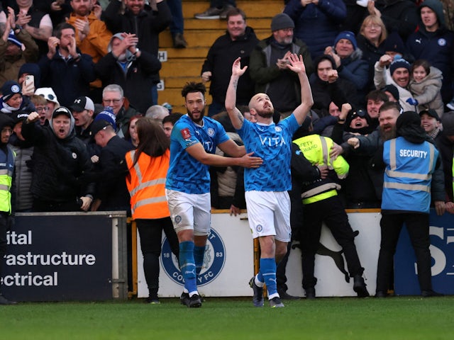 Stockport County's Paddy Madden celebrates scoring their first goal on January 8, 2023