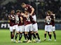 Torino's Koffi Djidji celebrates scoring their first goal with teammates on October 30, 2022