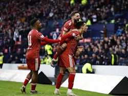 Aberdeen's Bojan Miovski celebrates scoring their first goal with Hayden Coulson and Duk on January 15, 2023