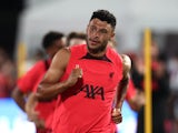 Alex Oxlade-Chamberlain warms up for Liverpool in July 2022