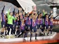Barcelona's Sergio Busquets lifts the trophy as he celebrates with teammates after winning the Spanish Super Cup on January 15, 2023
