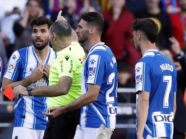 Espanyol's Leandro Cabrera reacts after being shown a red card by referee Antonio Mateu Lahoz that is later rescinded after a VAR review on December 31, 2022