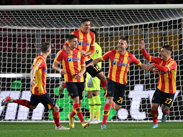 Lecce's Alexis Blin with teammates celebrate after AC Milan's Theo Hernandez scores an own goal and Lecce's first on January 14, 2023