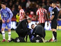Bournemouth's Lewis Cook receives medical attention after sustaining an injury on January 14, 2023