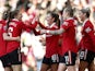 Manchester United Women's Katie Zelem celebrates scoring their first goal with teammates on December 3, 2022