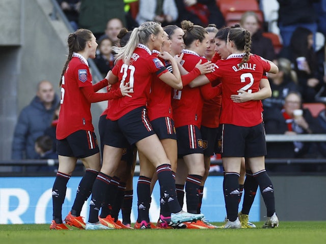 Manchester United Women's Lucia Garcia scores their first goal with teammates on January 15, 2023