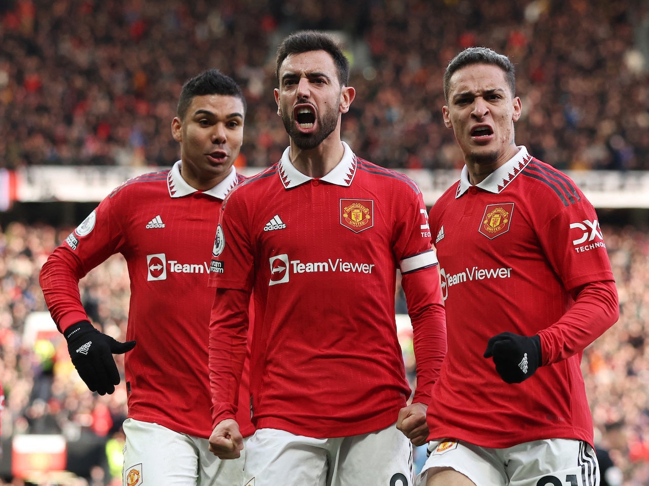 Manchester United's Bruno Fernandes celebrates scoring their first goal with Casemiro and Antony on January 14, 2023 - Sports Mole