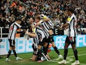 Newcastle United's Dan Burn celebrates scoring their first goal with teammates on January 10, 2023