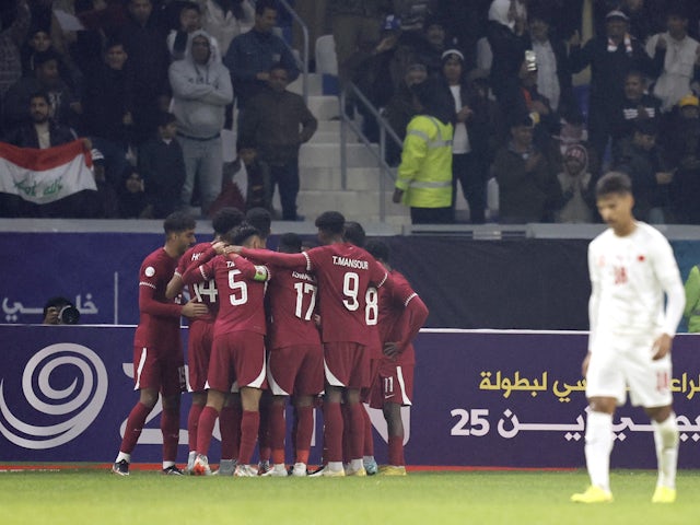 Qatar's Ahmed Alaaeldin celebrates scoring their first goal with teammates on January 10, 2023