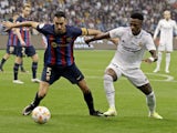 Barcelona's Sergio Busquets in action with Real Madrid's Vinicius Junior on January 15, 2023