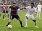 Barcelona's Sergio Busquets in action with Real Madrid's Vinicius Junior on January 15, 2023