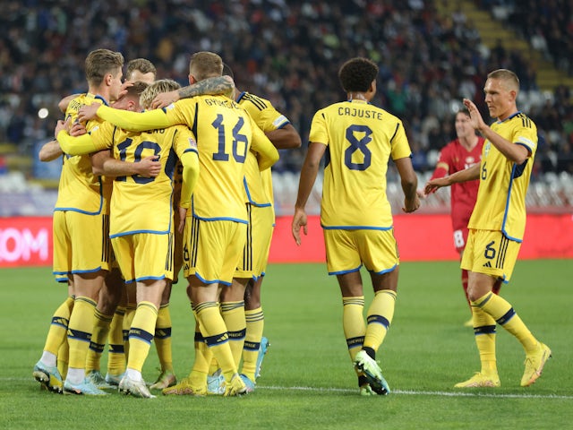 Sweden's Viktor Claesson celebrates scoring their first goal with teammates on September 24, 2022