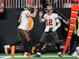 Tampa Bay Buccaneers tight end Kyle Rudolph (8) and quarterback Tom Brady (12) celebrate after a touchdown pass against the Atlanta Falcons in the first quarter at Mercedes-Benz Stadium on January 8, 2023