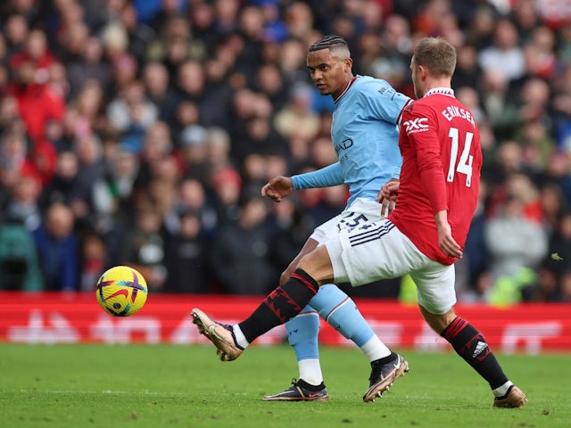 Manchester City's Manuel Akanji in action with Manchester United's Christian Eriksen on January 14, 2023