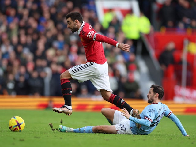 Manchester United's Bruno Fernandes in action with Manchester City's Bernardo Silva on January 14, 2023