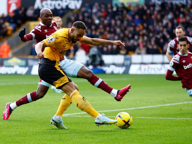 Wolverhampton Wanderers' Matheus Cunha in action with West Ham United's Angelo Ogbonna on January 14, 2023