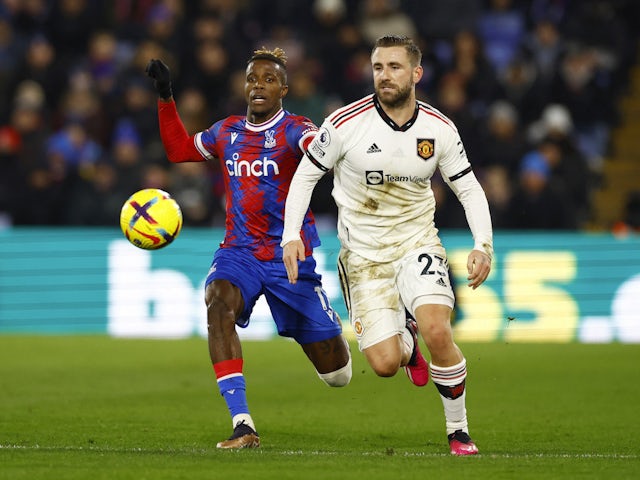 Crystal Palace's Wilfried Zaha in action with Manchester United's Luke Shaw on January 18, 2023