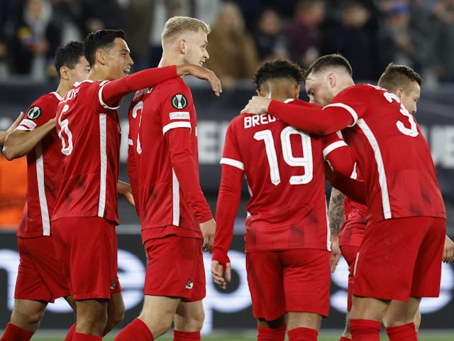AZ Alkmaar's Jens Odgaard celebrates scoring their first goal with teammates on October 6, 2022