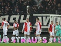 Feyenoord's Orkun Kokcu with teammates look dejected after the match SK Sturm Graz's Otar Kiteishvili scored their first goal on October 27, 2022