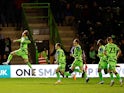 Forest Green Rovers' Ben Stevenson celebrates scoring their first goal with teammates on January 17, 2023