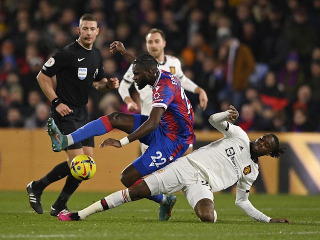 Crystal Palace's Odsonne Edouard in action with Manchester United's Aaron Wan-Bissaka on January 18, 2023