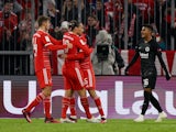 Bayern Munich's Leroy Sane celebrates scoring their first goal with Josip Stanisic and Thomas Muller as Eintracht Frankfurt's Ansgar Knauff reacts on January 28, 2023