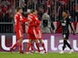 Bayern Munich's Leroy Sane celebrates scoring their first goal with Josip Stanisic and Thomas Muller as Eintracht Frankfurt's Ansgar Knauff reacts on January 28, 2023