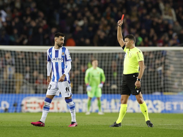 Real Sociedad's Brais Mendez is shown a red card by referee Jesus Gil Manzano on January 25, 2023