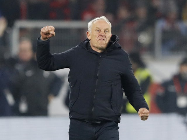 Freiburg coach Christian Streich celebrates after Matthias Ginter scores their first goal on January 25, 2023