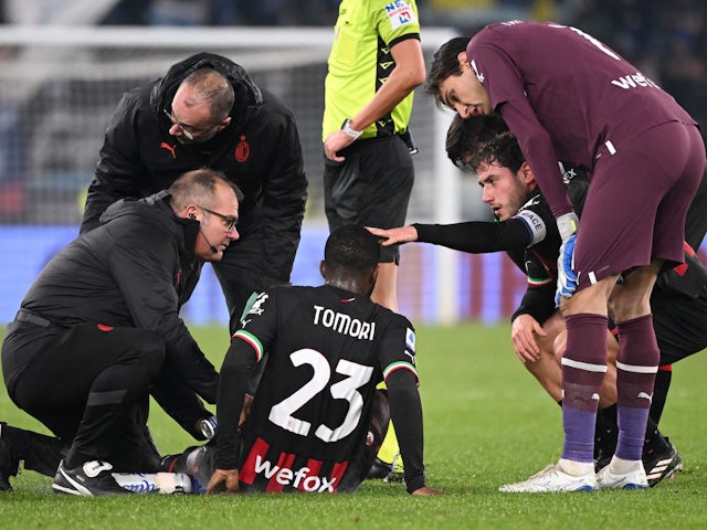 AC Milan's Fikayo Tomori receives medical assistance after sustaining an injury on January 24, 2023