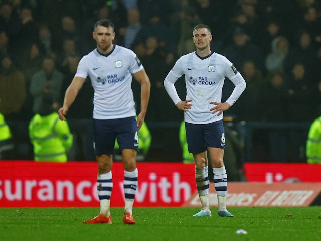Preston North End's Liam Lindsay and Benjamin Whiteman react after Tottenham Hotspur's Arnaut Danjuma scores their third goal on January 28, 2023