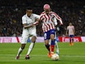 Real Madrid's Eder Militao in action with Atletico Madrid's Antoine Griezmann on January 26, 2023