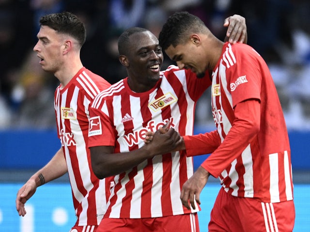 Union Berlin's Danilho Doekhi celebrates scoring their first goal with Jerome Roussillon and Janik Haberer on January 28, 2023