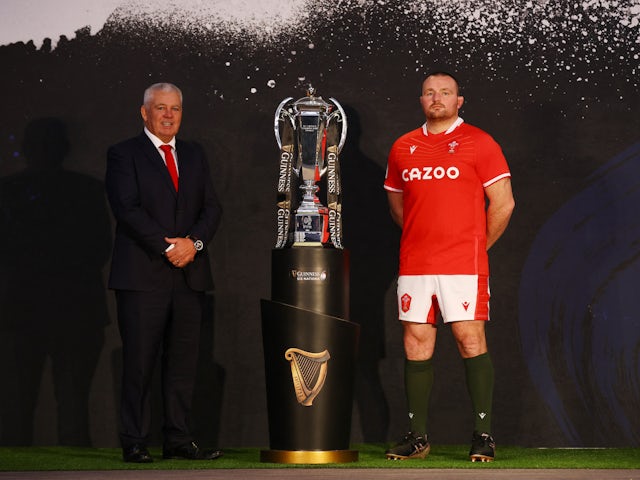 Wales' Ken Owens and head coach Warren Gatland pose with the Six Nations trophy during the launch on January 23, 2023
