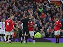 Manchester United's Casemiro is shown a red card by referee Andre Marriner on February 4, 2023