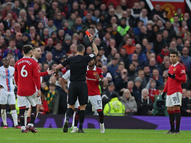 Manchester United's Casemiro is shown a red card by referee Andre Marriner on February 4, 2023