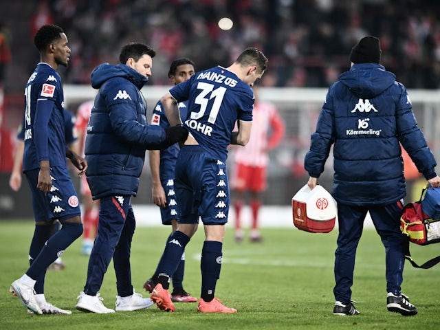 Mainz 05's Dominik Kohr receives medical attention after sustaining an injury on February 4, 2023