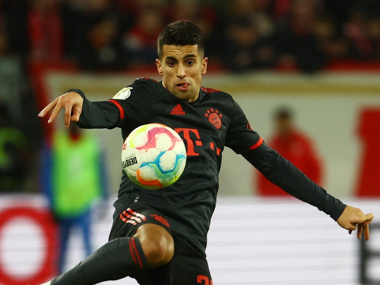 Manchester City's Joao Cancelo heads the ball during the Champions