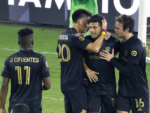 Los Angeles FC forward Carlos Vela (10) celebrates with forward Danny Musovski (16) and midfielder Eduard Atuesta (20) and midfielder Jose Cifuentes (11) after a goal against Cruz Azul in the first half during the 2020SCCL quarterfinals at Exploria Stadiu