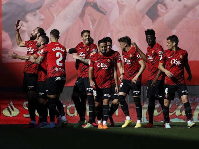 Mallorca's Vedat Muriqi celebrates scoring their first goal with teammates on February 5, 2023