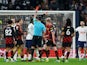 Tottenham Hotspur's Cristian Romero is shown a red card by referee Andrew Madley after receiving two yellow cards on February 5, 2023