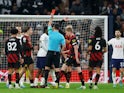 Tottenham Hotspur's Cristian Romero is shown a red card by referee Andrew Madley after receiving two yellow cards on February 5, 2023