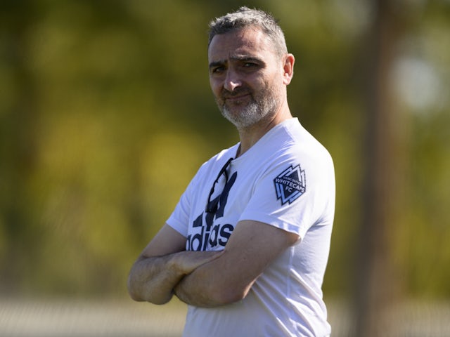 Vancouver Whitecaps FC head coach Vanni Sartini watches warm ups before the game against Charlotte FC at Empire Polo Club on February 4, 2023