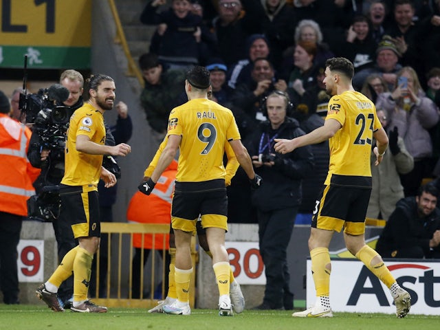 Wolverhampton Wanderers' Ruben Neves celebrates scoring their third goal with teammates on February 4, 2023